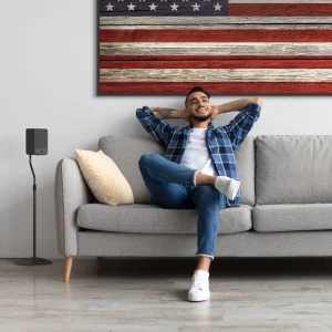 Klipsch_Flexus-SURR-100-beside-relaxing-guy_2000x2000